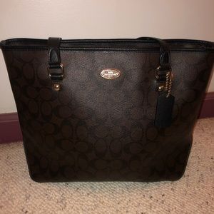 Brown and black coach tote purse